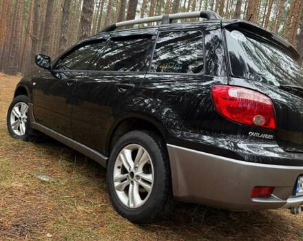 Черный Мицубиси Аутлендер, объемом двигателя 2 л и пробегом 232 тыс. км за 7000 $, фото 5 на Automoto.ua