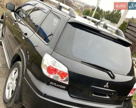 Черный Мицубиси Аутлендер, объемом двигателя 2.4 л и пробегом 178 тыс. км за 6900 $, фото 24 на Automoto.ua