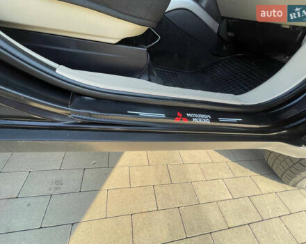 Чорний Міцубісі Аутлендер, об'ємом двигуна 2.4 л та пробігом 195 тис. км за 8600 $, фото 10 на Automoto.ua