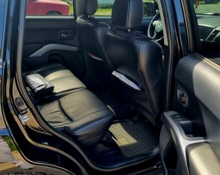 Черный Мицубиси Аутлендер, объемом двигателя 2.4 л и пробегом 234 тыс. км за 9800 $, фото 4 на Automoto.ua