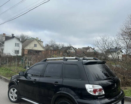 Чорний Міцубісі Аутлендер, об'ємом двигуна 2 л та пробігом 118 тис. км за 8100 $, фото 15 на Automoto.ua