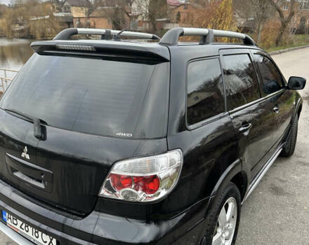 Чорний Міцубісі Аутлендер, об'ємом двигуна 2 л та пробігом 118 тис. км за 8100 $, фото 11 на Automoto.ua
