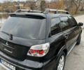 Чорний Міцубісі Аутлендер, об'ємом двигуна 2 л та пробігом 118 тис. км за 8100 $, фото 11 на Automoto.ua