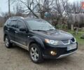 Черный Мицубиси Аутлендер, объемом двигателя 3 л и пробегом 152 тыс. км за 8700 $, фото 1 на Automoto.ua