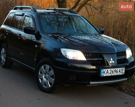 Черный Мицубиси Аутлендер, объемом двигателя 2 л и пробегом 190 тыс. км за 6900 $, фото 32 на Automoto.ua