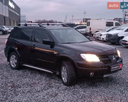 Чорний Міцубісі Аутлендер, об'ємом двигуна 2 л та пробігом 271 тис. км за 6940 $, фото 11 на Automoto.ua