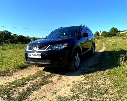 Черный Мицубиси Аутлендер, объемом двигателя 2.4 л и пробегом 217 тыс. км за 7300 $, фото 1 на Automoto.ua