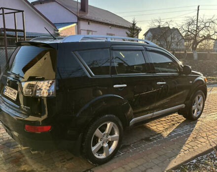 Черный Мицубиси Аутлендер, объемом двигателя 2.36 л и пробегом 253 тыс. км за 9600 $, фото 3 на Automoto.ua
