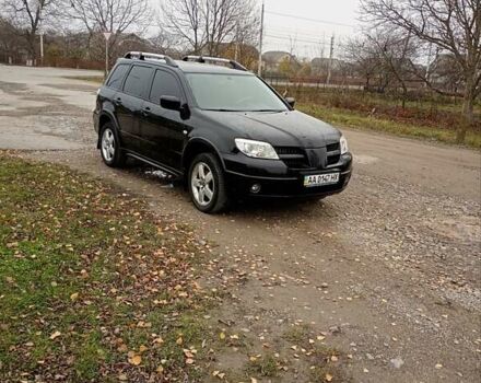 Черный Мицубиси Аутлендер, объемом двигателя 2 л и пробегом 209 тыс. км за 5700 $, фото 6 на Automoto.ua