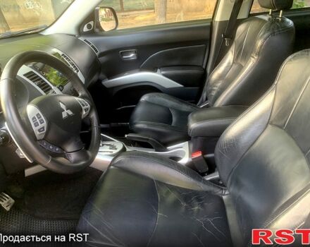 Черный Мицубиси Аутлендер, объемом двигателя 2.4 л и пробегом 230 тыс. км за 8500 $, фото 5 на Automoto.ua