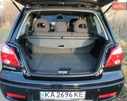 Черный Мицубиси Аутлендер, объемом двигателя 2 л и пробегом 189 тыс. км за 7200 $, фото 62 на Automoto.ua