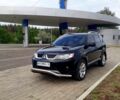 Черный Мицубиси Аутлендер, объемом двигателя 2.4 л и пробегом 180 тыс. км за 8900 $, фото 1 на Automoto.ua