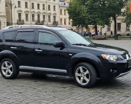 Черный Мицубиси Аутлендер, объемом двигателя 2.36 л и пробегом 246 тыс. км за 9700 $, фото 1 на Automoto.ua