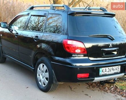 Черный Мицубиси Аутлендер, объемом двигателя 2 л и пробегом 190 тыс. км за 6900 $, фото 2 на Automoto.ua