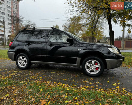 Чорний Міцубісі Аутлендер, об'ємом двигуна 2 л та пробігом 254 тис. км за 7499 $, фото 9 на Automoto.ua