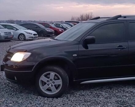 Черный Мицубиси Аутлендер, объемом двигателя 2 л и пробегом 271 тыс. км за 6940 $, фото 3 на Automoto.ua