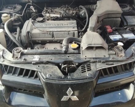 Черный Мицубиси Аутлендер, объемом двигателя 2 л и пробегом 212 тыс. км за 6900 $, фото 7 на Automoto.ua