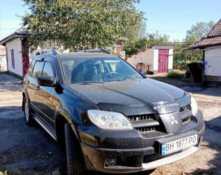 Черный Мицубиси Аутлендер, объемом двигателя 2 л и пробегом 240 тыс. км за 6500 $, фото 1 на Automoto.ua