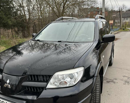 Чорний Міцубісі Аутлендер, об'ємом двигуна 2 л та пробігом 118 тис. км за 8100 $, фото 3 на Automoto.ua