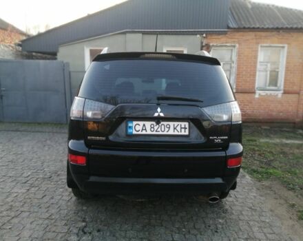 Черный Мицубиси Аутлендер, объемом двигателя 2.4 л и пробегом 228 тыс. км за 7850 $, фото 5 на Automoto.ua