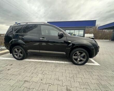 Чорний Міцубісі Аутлендер, об'ємом двигуна 2.4 л та пробігом 218 тис. км за 10000 $, фото 12 на Automoto.ua