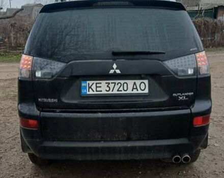 Черный Мицубиси Аутлендер, объемом двигателя 3 л и пробегом 152 тыс. км за 8700 $, фото 4 на Automoto.ua