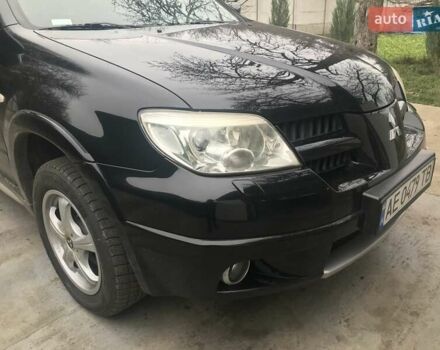 Чорний Міцубісі Аутлендер, об'ємом двигуна 2.38 л та пробігом 207 тис. км за 7000 $, фото 13 на Automoto.ua