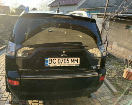 Черный Мицубиси Аутлендер, объемом двигателя 2.36 л и пробегом 253 тыс. км за 9600 $, фото 2 на Automoto.ua