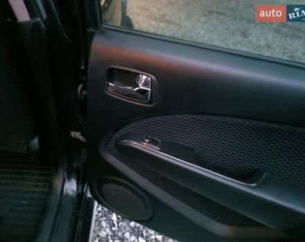 Чорний Міцубісі Аутлендер, об'ємом двигуна 2 л та пробігом 271 тис. км за 6940 $, фото 19 на Automoto.ua