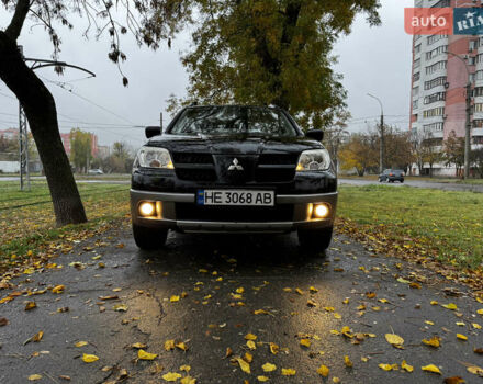 Чорний Міцубісі Аутлендер, об'ємом двигуна 2 л та пробігом 254 тис. км за 7499 $, фото 1 на Automoto.ua