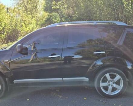 Черный Мицубиси Аутлендер, объемом двигателя 2.4 л и пробегом 178 тыс. км за 9150 $, фото 4 на Automoto.ua