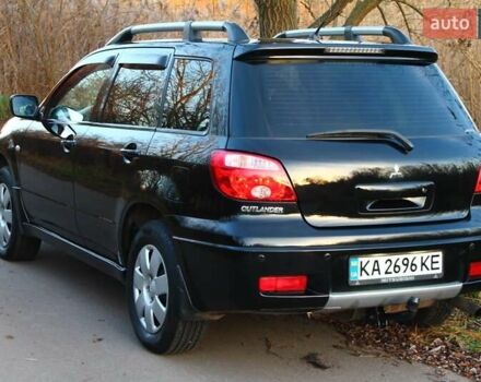 Черный Мицубиси Аутлендер, объемом двигателя 2 л и пробегом 190 тыс. км за 6900 $, фото 17 на Automoto.ua