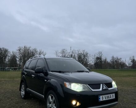 Черный Мицубиси Аутлендер, объемом двигателя 2.4 л и пробегом 230 тыс. км за 8800 $, фото 1 на Automoto.ua