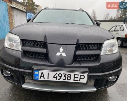 Черный Мицубиси Аутлендер, объемом двигателя 2 л и пробегом 306 тыс. км за 6500 $, фото 2 на Automoto.ua