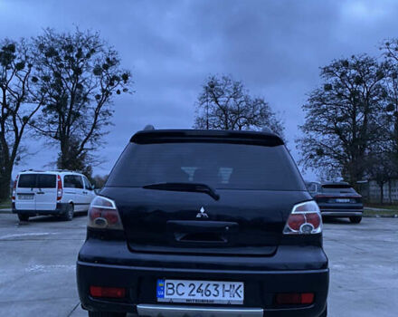 Чорний Міцубісі Аутлендер, об'ємом двигуна 2 л та пробігом 271 тис. км за 6799 $, фото 4 на Automoto.ua