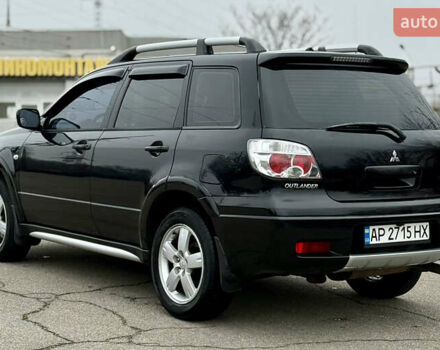 Черный Мицубиси Аутлендер, объемом двигателя 2.4 л и пробегом 245 тыс. км за 6500 $, фото 7 на Automoto.ua