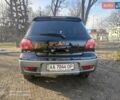 Черный Мицубиси Аутлендер, объемом двигателя 2 л и пробегом 243 тыс. км за 6200 $, фото 2 на Automoto.ua