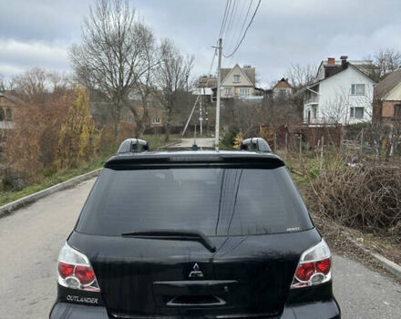 Чорний Міцубісі Аутлендер, об'ємом двигуна 2 л та пробігом 118 тис. км за 8100 $, фото 12 на Automoto.ua