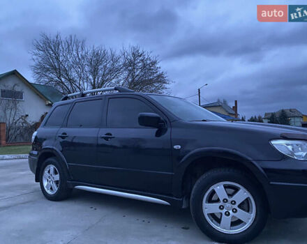 Чорний Міцубісі Аутлендер, об'ємом двигуна 2 л та пробігом 271 тис. км за 6799 $, фото 3 на Automoto.ua