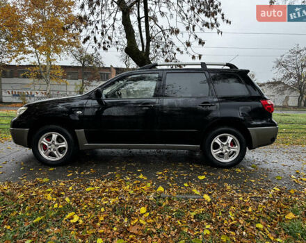 Чорний Міцубісі Аутлендер, об'ємом двигуна 2 л та пробігом 254 тис. км за 7499 $, фото 6 на Automoto.ua