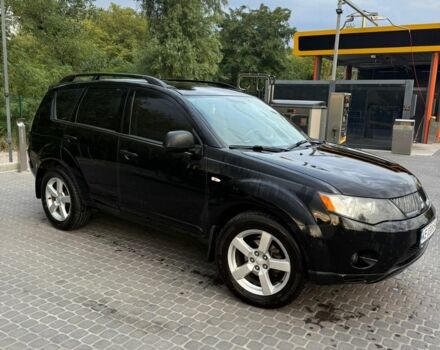 Черный Мицубиси Аутлендер, объемом двигателя 2.4 л и пробегом 369 тыс. км за 8500 $, фото 1 на Automoto.ua