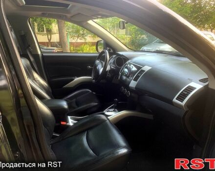 Черный Мицубиси Аутлендер, объемом двигателя 2.4 л и пробегом 230 тыс. км за 8500 $, фото 8 на Automoto.ua