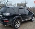Черный Мицубиси Аутлендер, объемом двигателя 3 л и пробегом 152 тыс. км за 8700 $, фото 5 на Automoto.ua