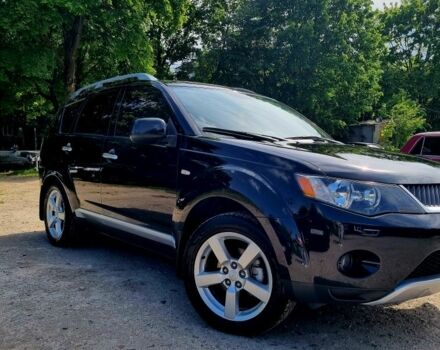 Черный Мицубиси Аутлендер, объемом двигателя 2.4 л и пробегом 234 тыс. км за 9800 $, фото 1 на Automoto.ua