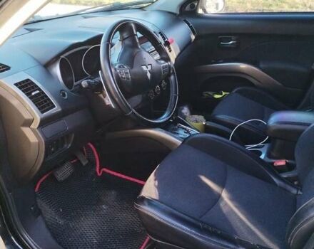 Черный Мицубиси Аутлендер, объемом двигателя 2.4 л и пробегом 199 тыс. км за 9000 $, фото 3 на Automoto.ua