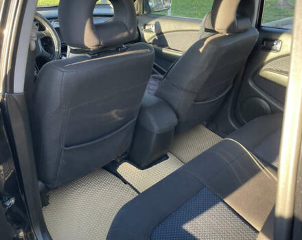 Чорний Міцубісі Аутлендер, об'ємом двигуна 2 л та пробігом 218 тис. км за 6300 $, фото 24 на Automoto.ua