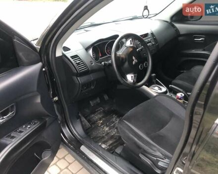 Чорний Міцубісі Аутлендер, об'ємом двигуна 2.4 л та пробігом 199 тис. км за 8999 $, фото 1 на Automoto.ua