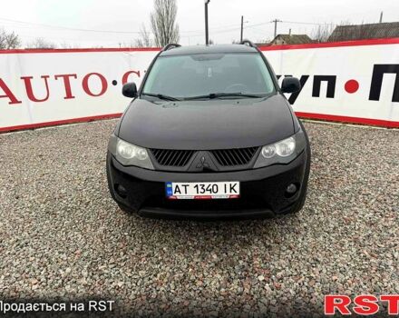 Черный Мицубиси Аутлендер, объемом двигателя 2.4 л и пробегом 200 тыс. км за 9999 $, фото 1 на Automoto.ua