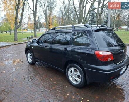 Чорний Міцубісі Аутлендер, об'ємом двигуна 2 л та пробігом 191 тис. км за 7100 $, фото 8 на Automoto.ua
