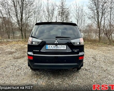 Черный Мицубиси Аутлендер, объемом двигателя 2.4 л и пробегом 229 тыс. км за 9790 $, фото 5 на Automoto.ua